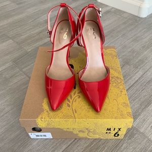 Brand new red patent pumps